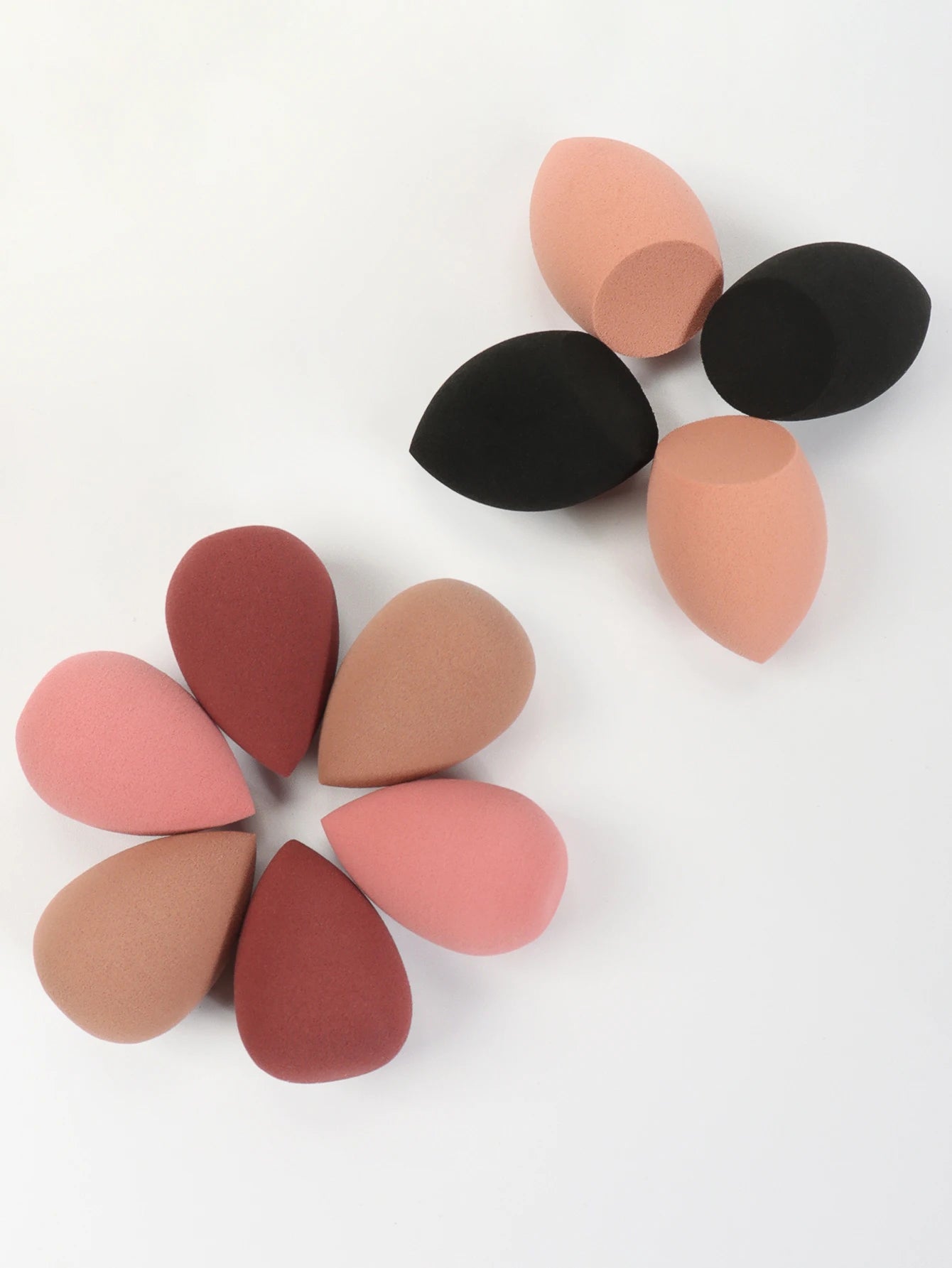 Set of 10 mini makeup sponges by amzzonstore, soft powder puffs for concealer, foundation, and liquid makeup application.