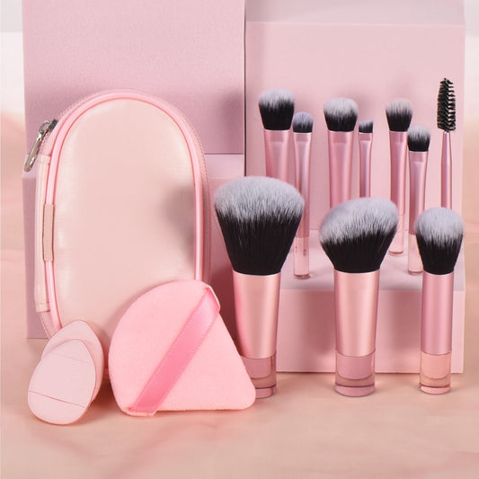 Pink mini makeup brush set with 10 portable palm-sized brushes and puffs, ideal for travel and professional makeup application