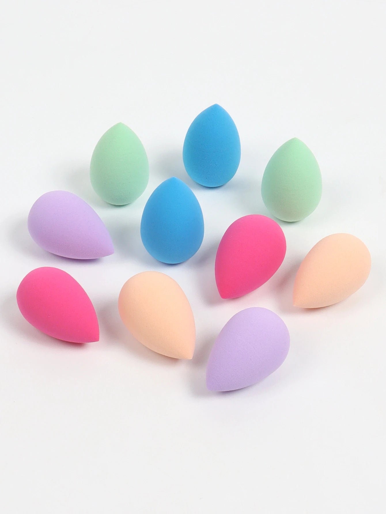 Set of 10 mini makeup sponges by amzzonstore, used for applying powder, concealer, and liquid foundation on the face.
