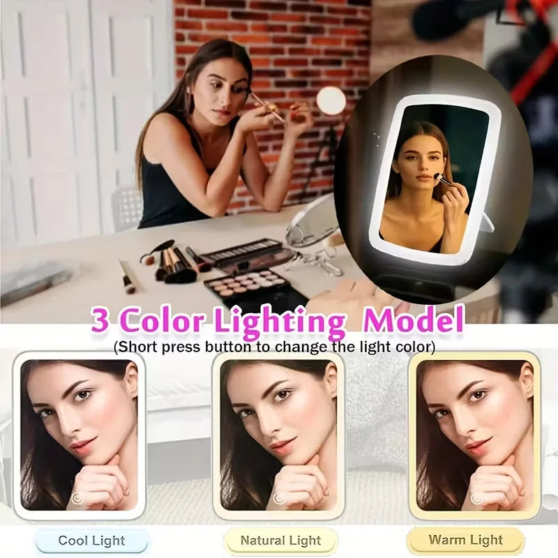 Portable LED makeup mirror with stand, folding square design, touch screen, and built-in lighting for travel and tabletop use.