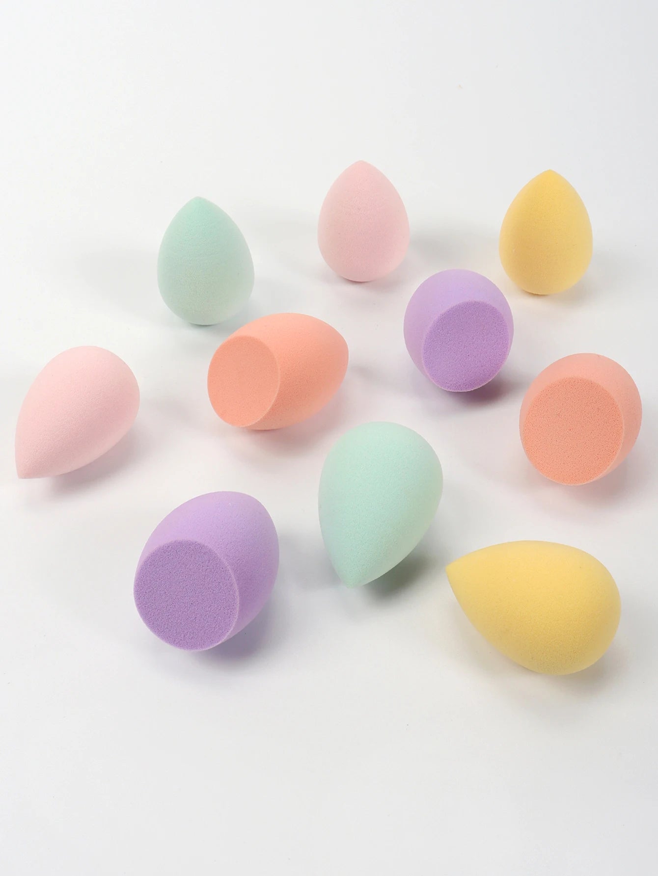 Set of 10 mini makeup sponges by amzzonstore, soft powder puffs for foundation, concealer, and liquid makeup application.