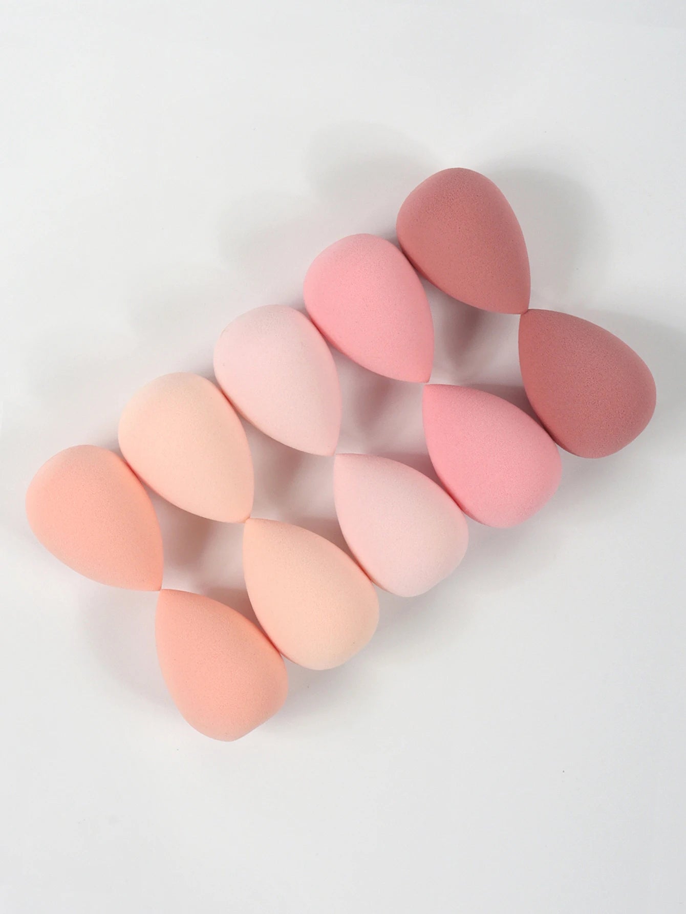 Set of 10 mini makeup sponges by amzzonstore for foundation, concealer, and face powder application, soft and versatile cosmetic puffs