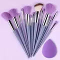 Set of 13 professional makeup brushes from amzzonstore including foundation, eyeshadow, blush, and blending brushes with soft, fluffy bristles.