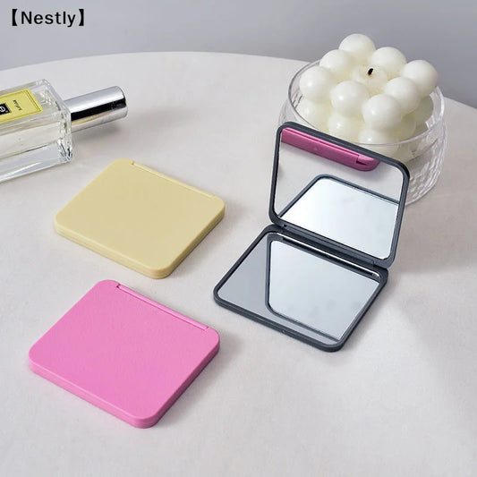 Portable 2-face square makeup mirror by amzzonstore, compact double-sided mirror in multiple colors, perfect for on-the-go beauty touches.