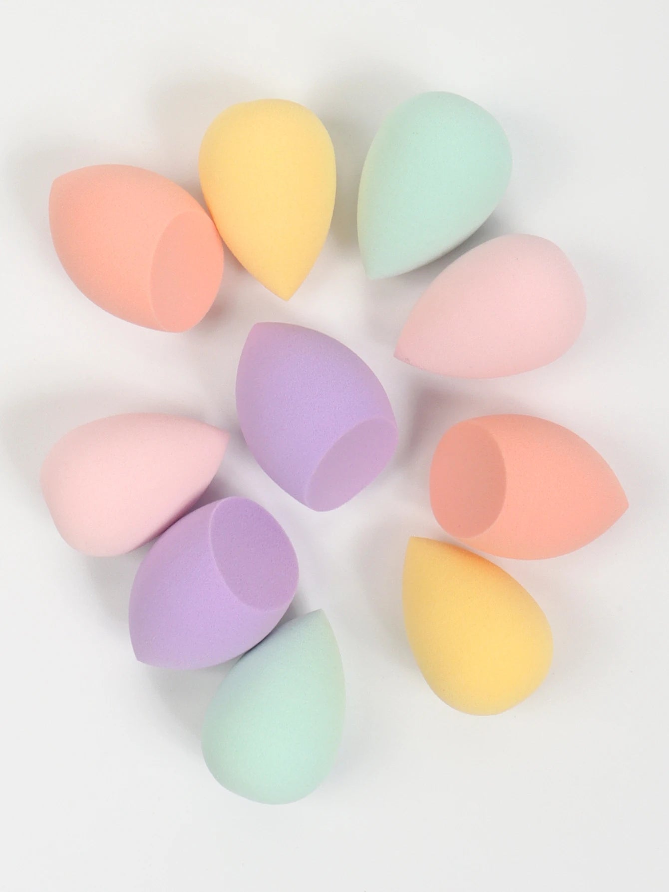 Set of 10 mini makeup sponges by amzzonstore, soft powder puffs for foundation, concealer, and liquid makeup application.
