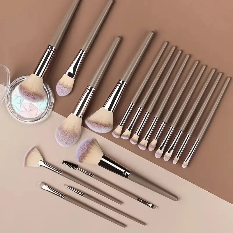 Set of professional 3-20 makeup brushes including foundation, eyeshadow, concealer, blush, and kabuki brushes in soft, fluffy bristles.