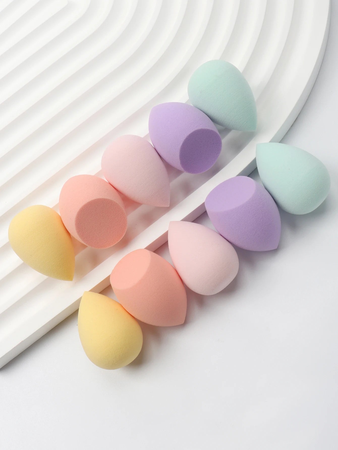 Mini makeup sponge set by amzzonstore featuring 10 cosmetic puffs for foundation, concealer, and liquid makeup application.