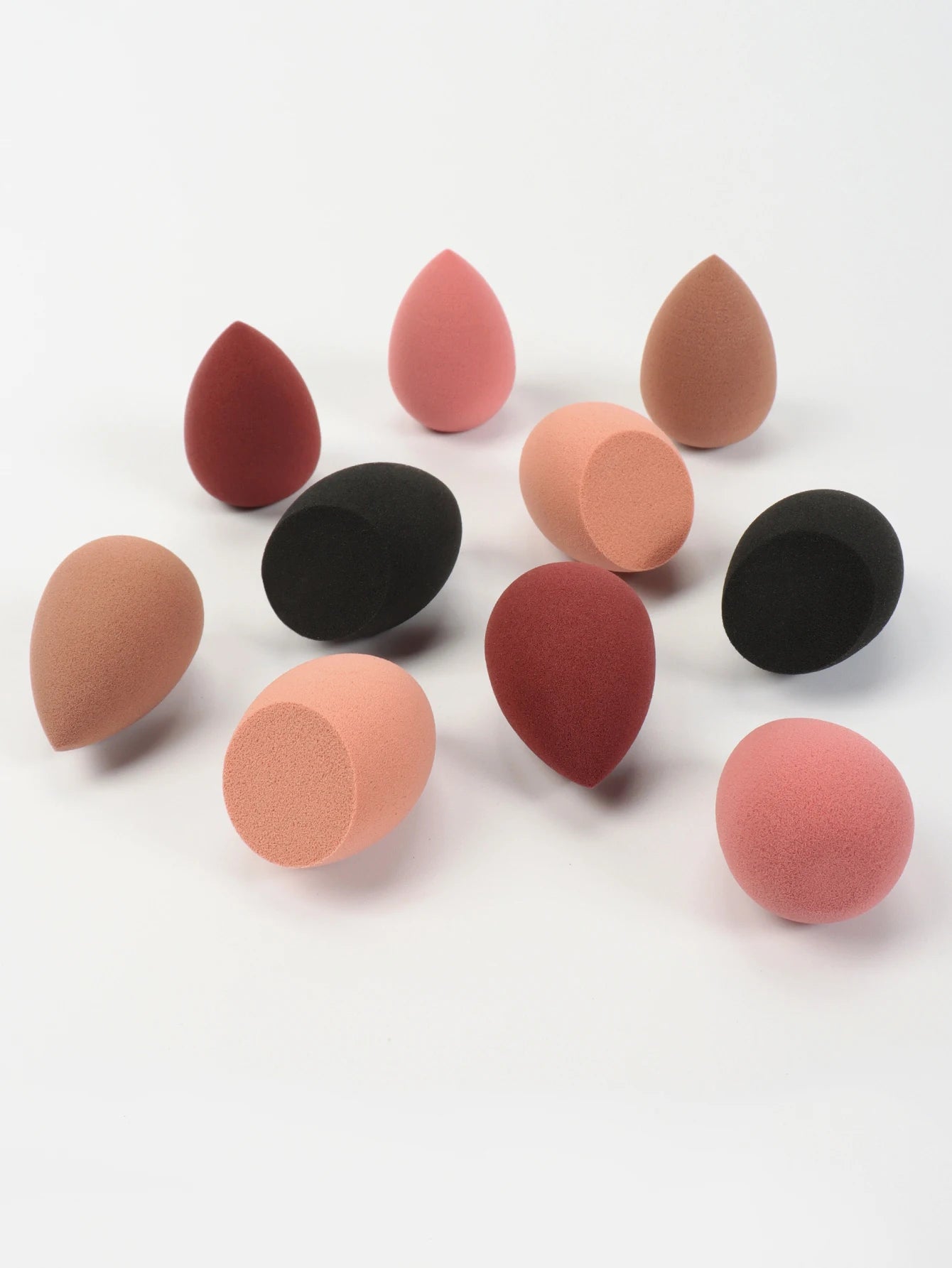 Set of 10 mini makeup sponges from amzzonstore, including powder puffs and beauty sponges for foundation, concealer, and face makeup.