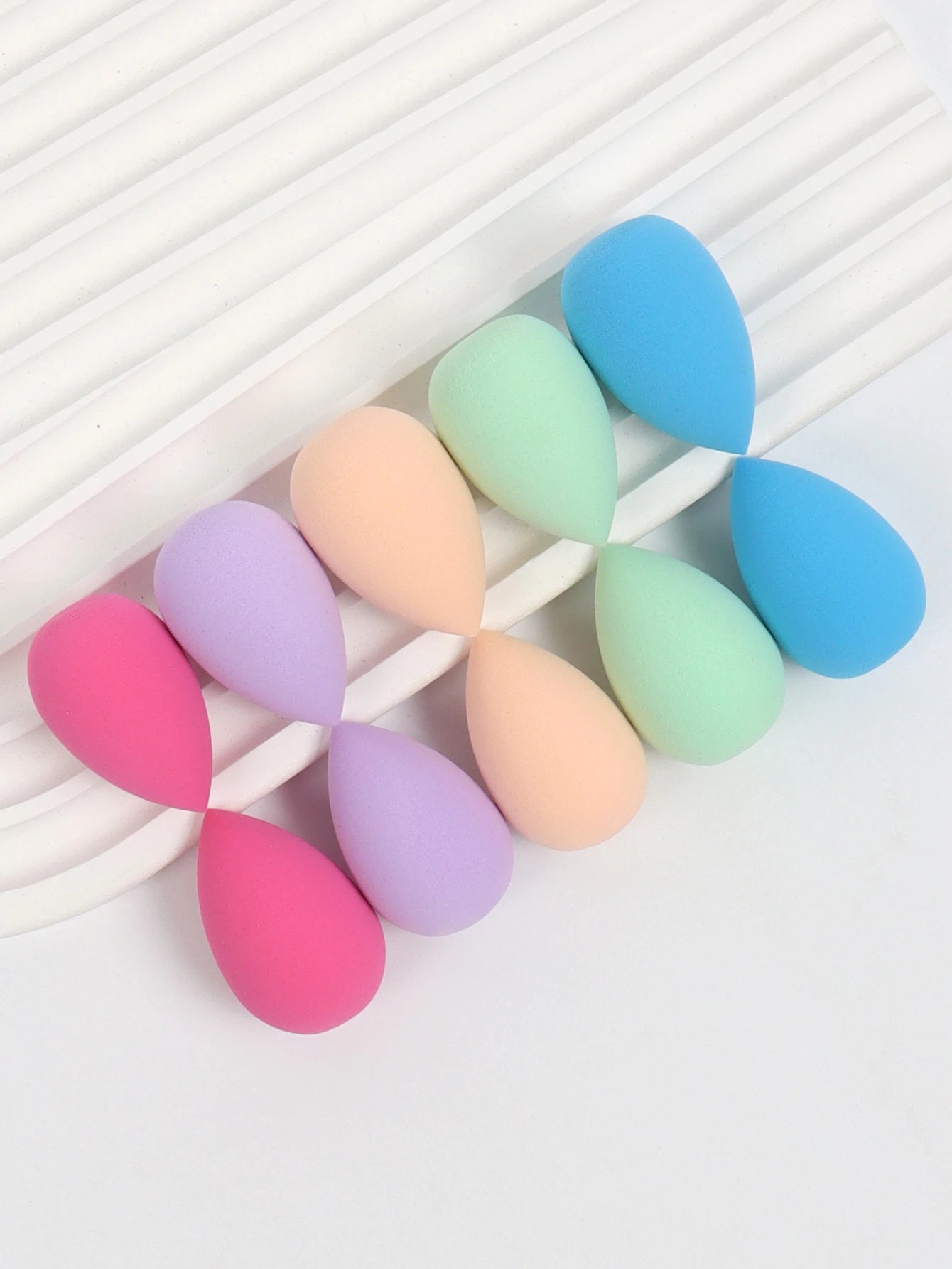 Set of 10 mini makeup sponge puffs for foundation, concealer, and powder application from amzzonstore, soft and reusable cosmetic sponges.