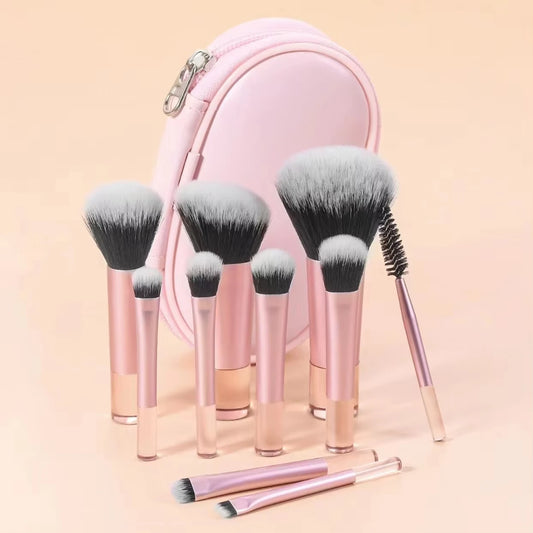 Set of 10 mini makeup brushes with a travel pouch, including face and eye brushes, ideal for portable cosmetic application.