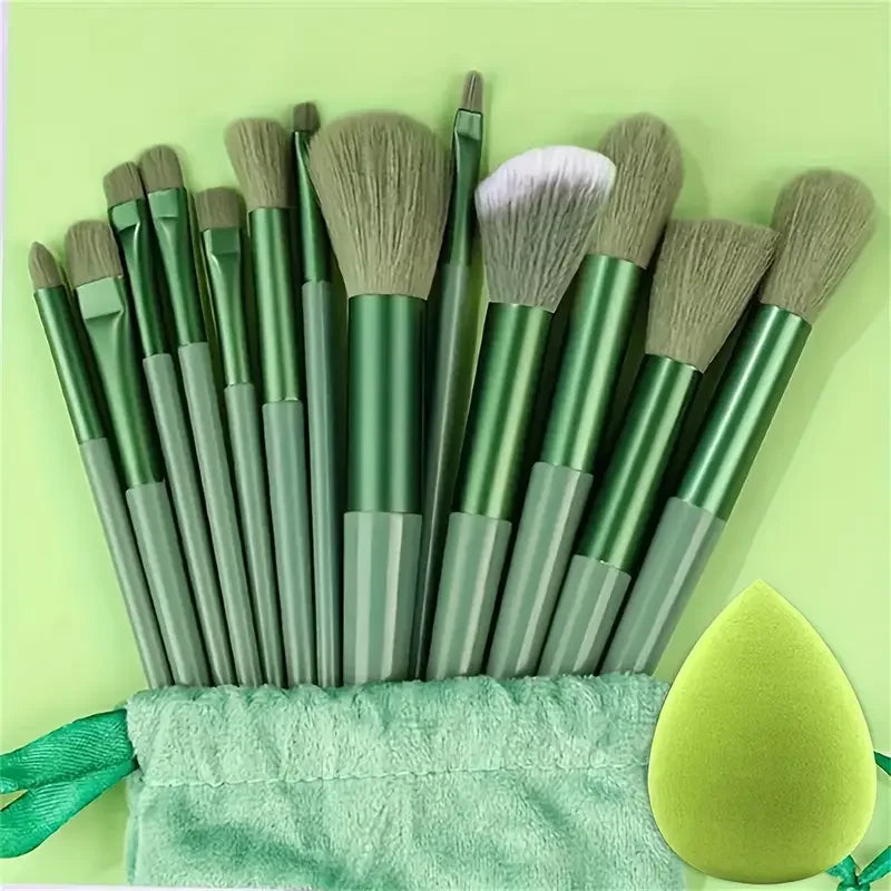 Set of 13 professional makeup brushes including foundation, eyeshadow, blush, and powder brushes with soft, fluffy bristles.
