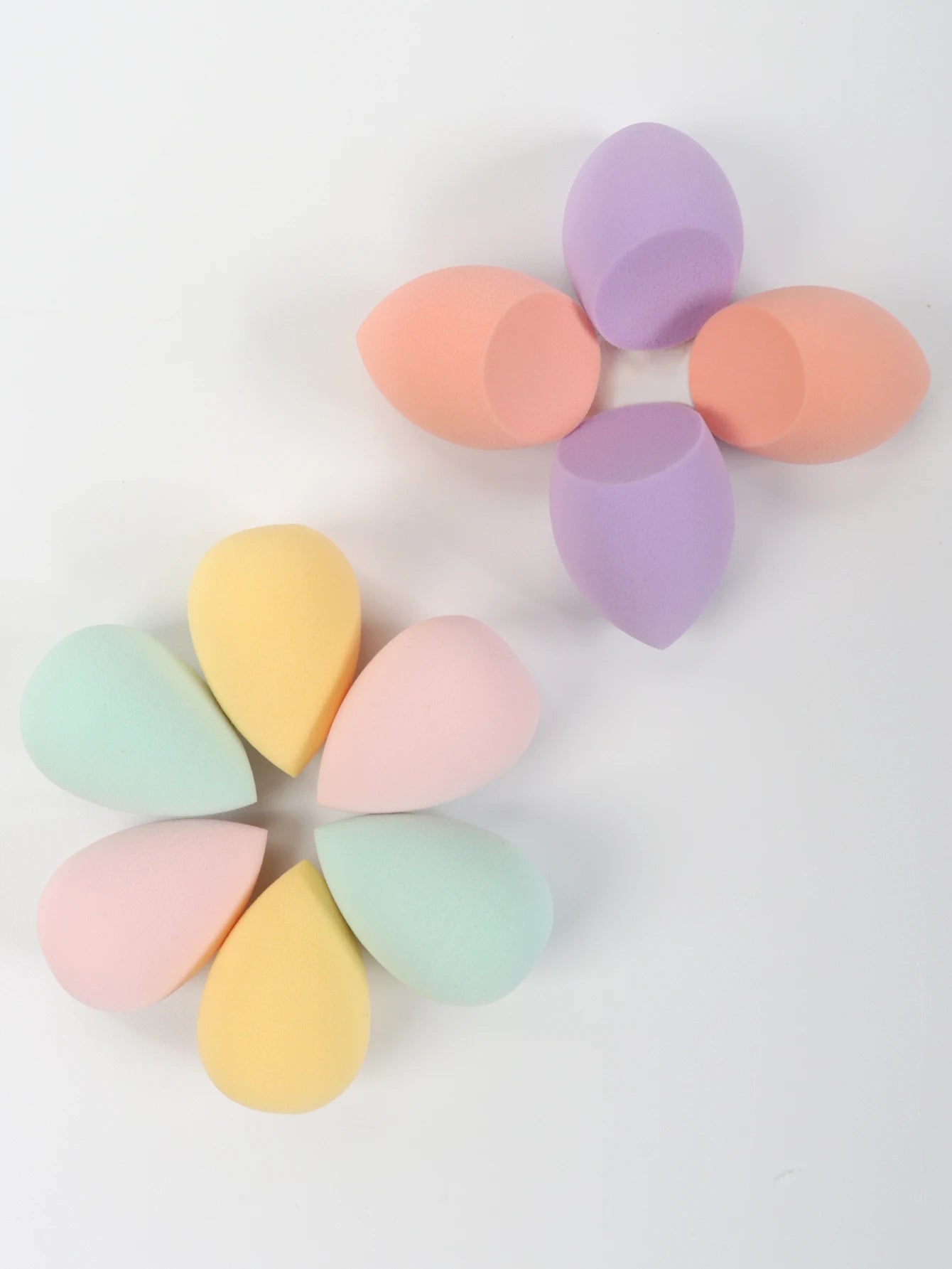 Set of 10 mini makeup sponges by amzzonstore for applying powder, foundation, concealer, and liquid makeup smoothly.