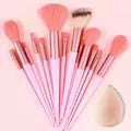 Set of 13 professional makeup brushes from amzzonstore, including foundation, eyeshadow, blush, and powder brushes with soft, fluffy bristles.