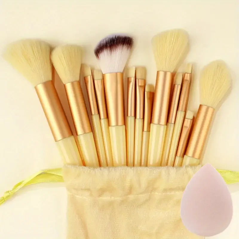 Set of 13 professional makeup brushes including foundation, eyeshadow, blush, and powder brushes with soft, fluffy bristles.